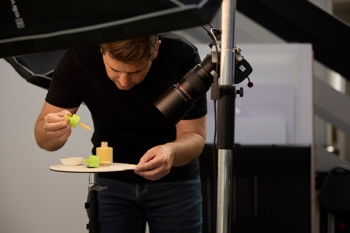 Commercial photographer Matt Reed in the Sum Effect Studio demonstrating professional process of image creation behind photo and video usage rights for brands.